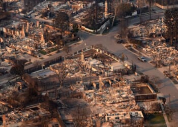 In this aerial view taken from a helicopter, homes burned from the Palisade fire smolder near the Pacific Palisades neighborhood of Los Angeles, California, on Jan. 9, 2025.