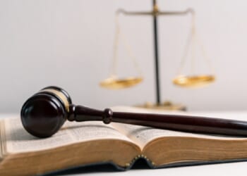 A Bible, a gavel and the scales of justice.