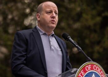 Colorado Governor Jared Polis speaks at a community gathering held for kidnapped Israeli citizens in Gaza on June 4, 2025 in Boulder, CO.