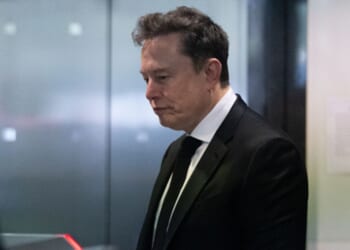 Elon Musk walks into an elevator at the Ronald V. Dellums Federal Court Building on April 28, 2026.