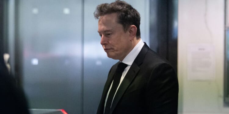 Elon Musk walks into an elevator at the Ronald V. Dellums Federal Court Building on April 28, 2026.
