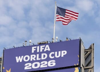 The American flag flies above FIFA World Cup signage in Seattle, Washington on June 19, 2026.