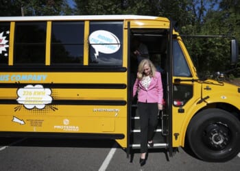 Abigail Spanberger stepping off a school bus