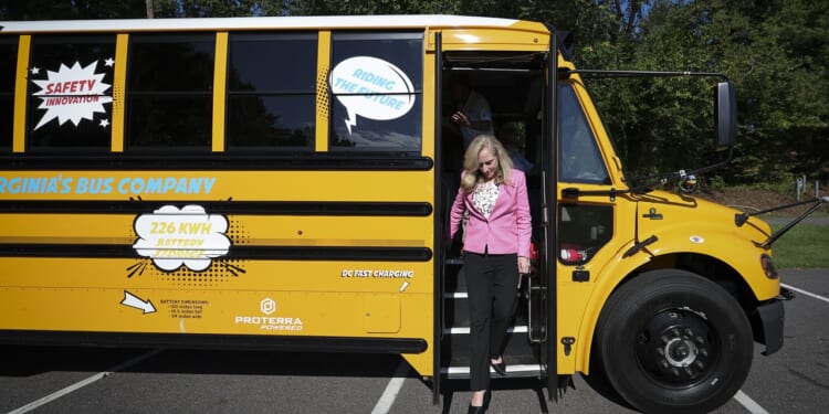 Abigail Spanberger stepping off a school bus