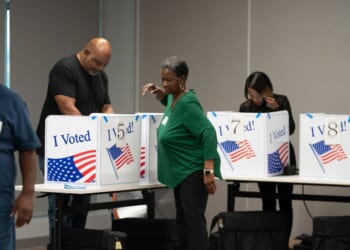 People fill out ballots on the first day of early voting at the County Voter Registration Office on May 26, 2026, in Columbia, South Carolina.