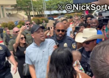 Police had to intervene as the crowd grew more hostile.