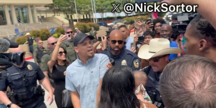 Police had to intervene as the crowd grew more hostile.