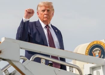President Donald Trump holding up a fist