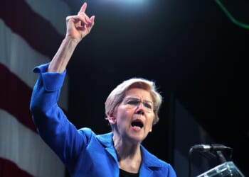Sen. Elizabeth Warren speaking with her finger pointing in the air