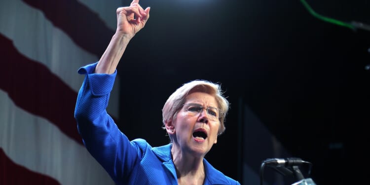 Sen. Elizabeth Warren speaking with her finger pointing in the air