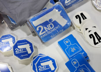 2nd Amendment stickers sit on a table.