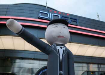 An inflatable tube man depicting businessman and entrepreneur Elon Musk is displayed during the "Tyrant Diner" protest, calling for a boycott of Tesla, outside of the Tesla Diner and Drive-In Restaurant and Supercharger on Santa Monica Blvd in the Hollywood neighborhood of Los Angeles, California, on Sept. 26, 2025.