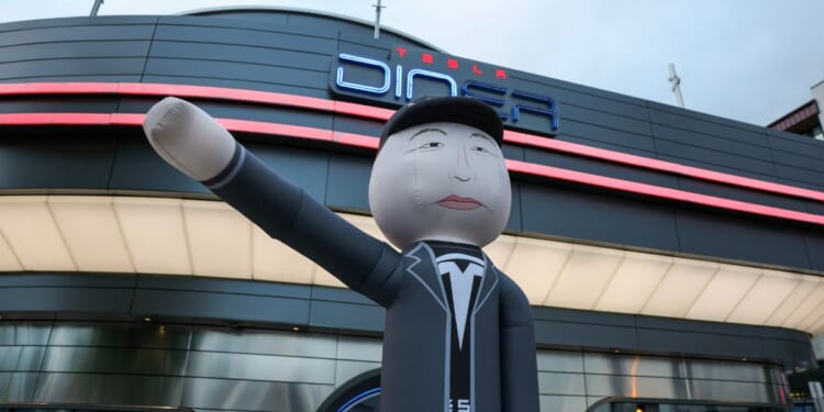 An inflatable tube man depicting businessman and entrepreneur Elon Musk is displayed during the "Tyrant Diner" protest, calling for a boycott of Tesla, outside of the Tesla Diner and Drive-In Restaurant and Supercharger on Santa Monica Blvd in the Hollywood neighborhood of Los Angeles, California, on Sept. 26, 2025.