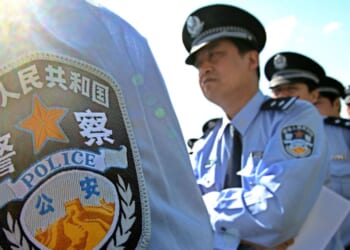 Chinese policeman line up for an exhibition of police equipment at a ceremony held in Beijing on May 17, 2007.