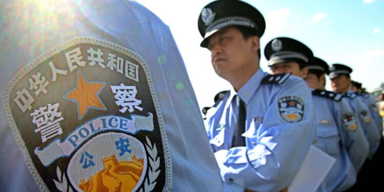Chinese policeman line up for an exhibition of police equipment at a ceremony held in Beijing on May 17, 2007.