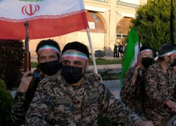 A group of militia members in Iran wear fatigues and celebrate the regime leader's birthday on April 29, 2026 in Isfahan, Iran.