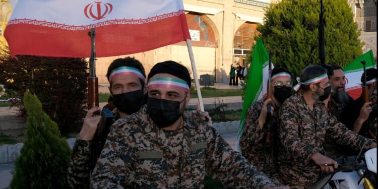 A group of militia members in Iran wear fatigues and celebrate the regime leader's birthday on April 29, 2026 in Isfahan, Iran.