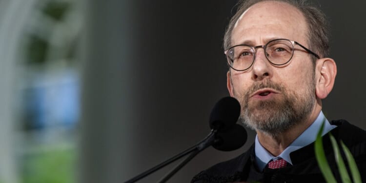 Harvard President Alan M. Garber speaking at a microphone