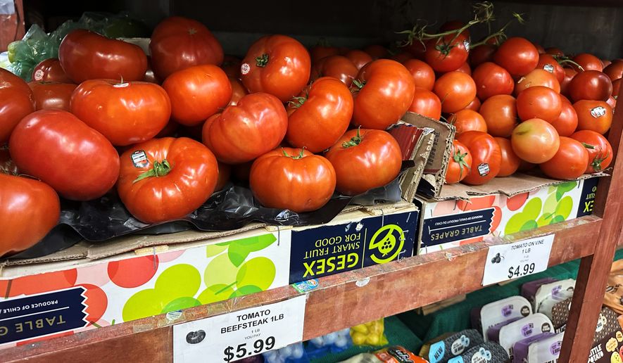 Tomatoes await customers on the shelves of a supermarket in New York on Tuesday, May 26, 2026. (AP Photo/Matt Sedensky) ** FILE **