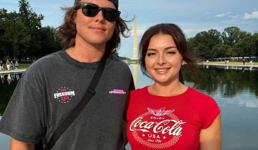 Jacob Burvis and Ellie Louizes, from Daytona Beach Fla., pose for a photo at the Lincoln Memorial, Friday, June 12, 2026, in Washington. (AP Photo/Fatima Hussein)