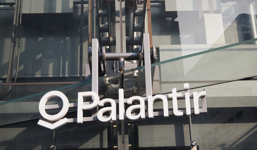 Palantir signage hangs on an office building in Tokyo's Shibuya Ward in Japan. The building is known as 'The Iceberg'. The global data-mining giant said Tuesday that it will relocate its headquarters from Denver to Miami, joining the wave of tech firms fleeing blue states for South Florida’s friendlier business habitat. (File Photo credit: Ned Snowman via Shutterstock) ** FIEL **