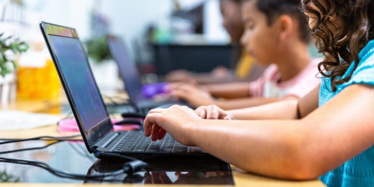 Elementary school students in a computer lab.