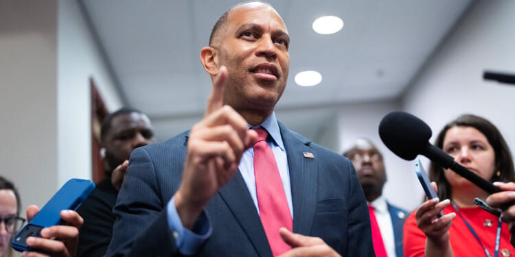 House Minority Leader Hakeem Jeffries talks with reporters in the Capitol Visitor Center.