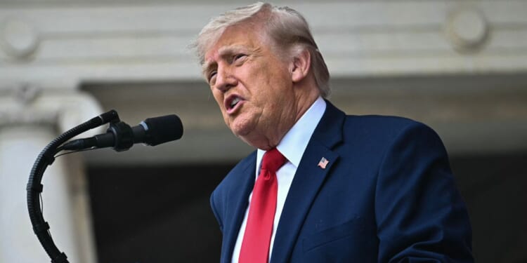 President Donald Trump speaks during the National Memorial Day Observance at the Memorial Amphitheatre in Arlington National Cemetery in Arlington, Virginia, on May 25, 2026.