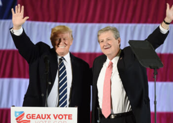 Donald Trump stands beside Louisiana Treasurer and Republican Senate candidate John Kennedy.