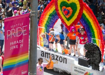 A parade float goes by at a Seattle Pride Parade in downtown.