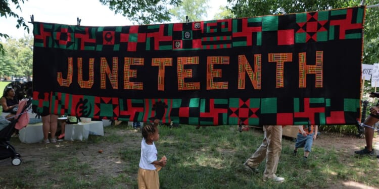 People attend a Juneteenth event in Brower Park on June 19, 2026, in the Crown Heights neighborhood of the Brooklyn borough in New York City.