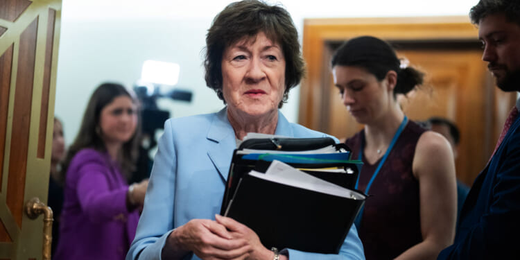 Sen. Susan Collins, R-Maine, arrives for the Senate Health, Education, Labor and Pensions Committee.