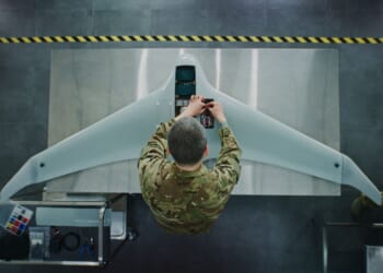 An engineer works on a drone.