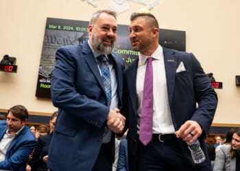 Tim Tebow, Founder of the Tim Tebow Foundation is greeted by Jim Cole, retired Homeland Security Investigations supervisor.