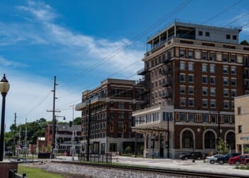 A view of the former Hotel Muscatine and the newly built Merrill Hotel and Conference Center as viewed from Harbor Drive in Riverside Park in Muscatine, Iowa, on July 17, 2018.