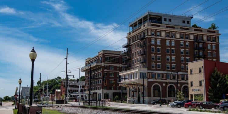A view of the former Hotel Muscatine and the newly built Merrill Hotel and Conference Center as viewed from Harbor Drive in Riverside Park in Muscatine, Iowa, on July 17, 2018.
