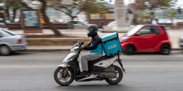 SLIEMA, MALTA - MARCH 8: A Wolt food-delivery rider makes a delivery on a scooter on March 8, 2026 in Sliema, Malta. (Photo by John Keeble/Getty Images)