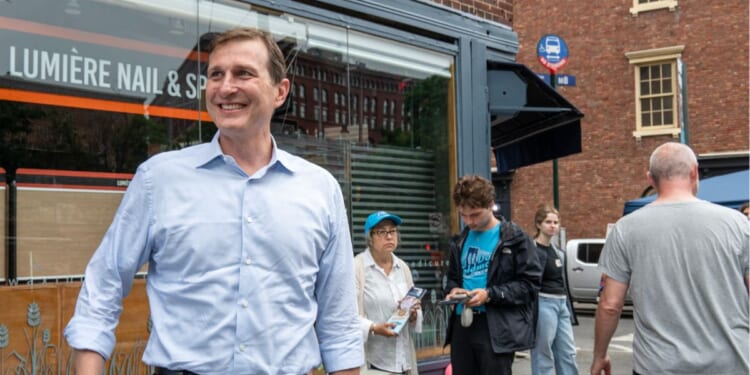 Rep. Dan Goldman greets voters outside a polling station in Manhattan's West Village on June 23, 2026, in New York City.