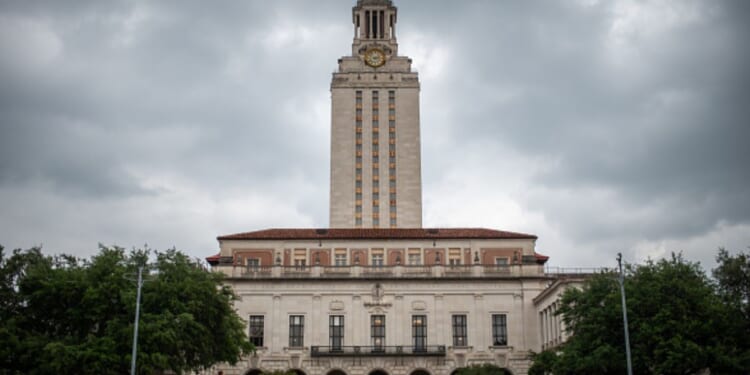 The University of Texas stands behind stormy skies in Austin, Texas on April 26, 2024.
