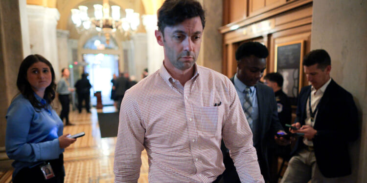 Sen. Jon Ossoff heads for a vote at the U.S. Capitol.