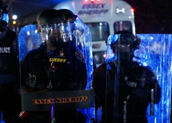 Police officers guard the Delaney Hall in Newark, New Jersey, on May 30, 2026.