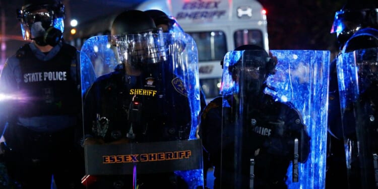 Police officers guard the Delaney Hall in Newark, New Jersey, on May 30, 2026.