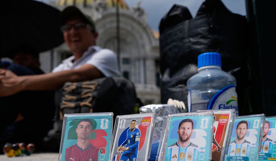 Panini World Cup stickers are displayed in the historic center in Mexico City, Tuesday, June 16, 2026. (AP Photo/Marco Ugarte)
