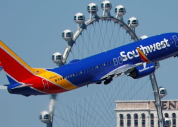 A Southwest Airlines Boeing 737 departs from Harry Reid International Airport in Las Vegas, Nevada, with the High Roller Ferris wheel in the background in a file photo from March 11.