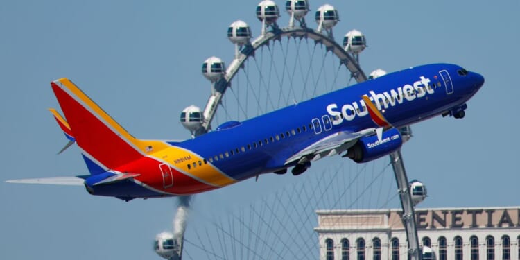 A Southwest Airlines Boeing 737 departs from Harry Reid International Airport in Las Vegas, Nevada, with the High Roller Ferris wheel in the background in a file photo from March 11.