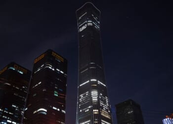 Broken windows and damage, center, are seen to a floor on the CITIC Tower, or China Zun, after it was struck by a small aircraft Friday in Beijing, China. The building, which is 109 stories tall, is the 10th largest building in the world.