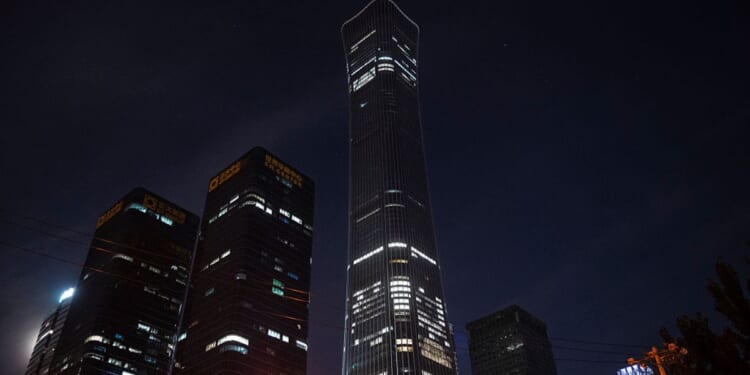 Broken windows and damage, center, are seen to a floor on the CITIC Tower, or China Zun, after it was struck by a small aircraft Friday in Beijing, China. The building, which is 109 stories tall, is the 10th largest building in the world.