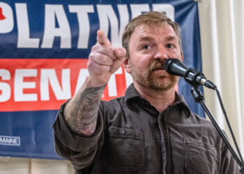 Graham Platner speaks to supporters at a rally.