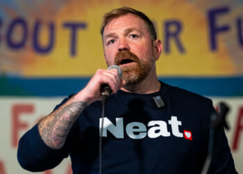 Graham Platner speaks at a rally.
