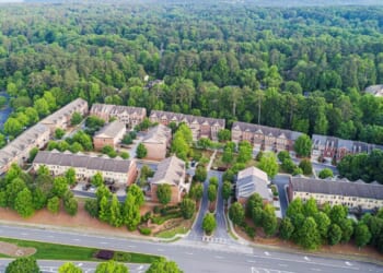 A neighborhood in Georgia is shown amidst a backdrop of trees.